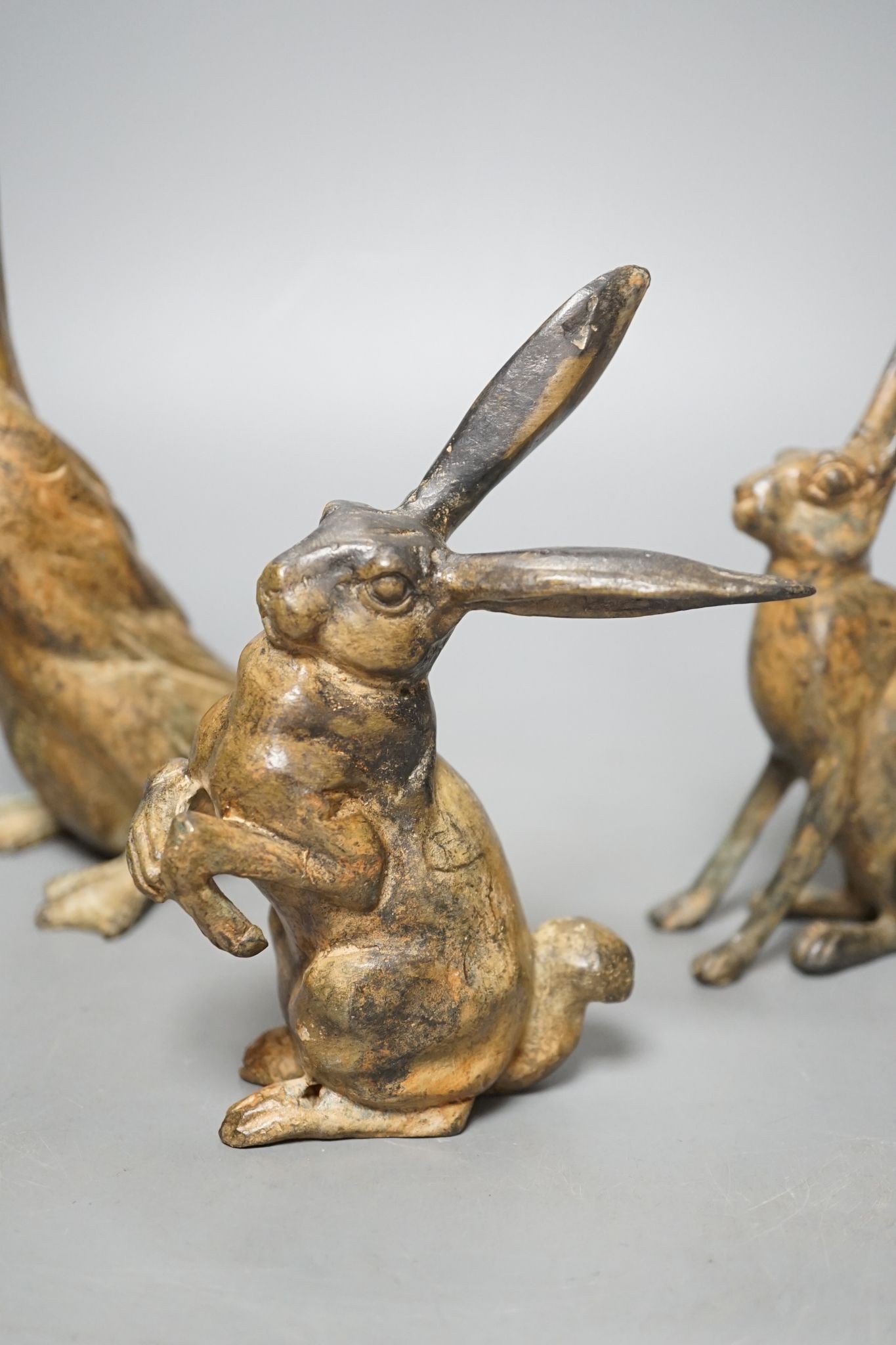 Pierre Chenet Foundry, four small patinated bronzes of a toad, two hares and a duck, largest 19cm high, signed